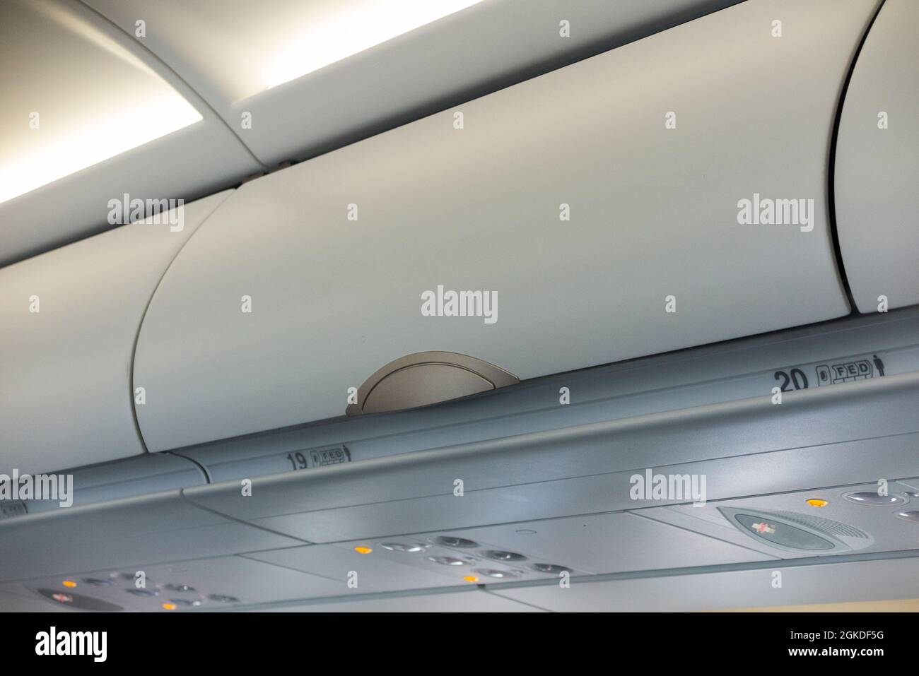 Overhead passenger locker / lockers / compartment / compartments for stowing passengers bags cabin luggage on an Airbus A321 neo plane / airplane. (127) Stock Photo