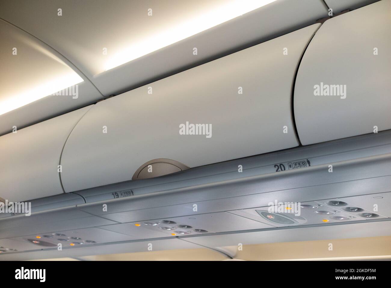 Overhead passenger locker / lockers / compartment / compartments for stowing passengers bags cabin luggage on an Airbus A321 neo plane / airplane. (127) Stock Photo