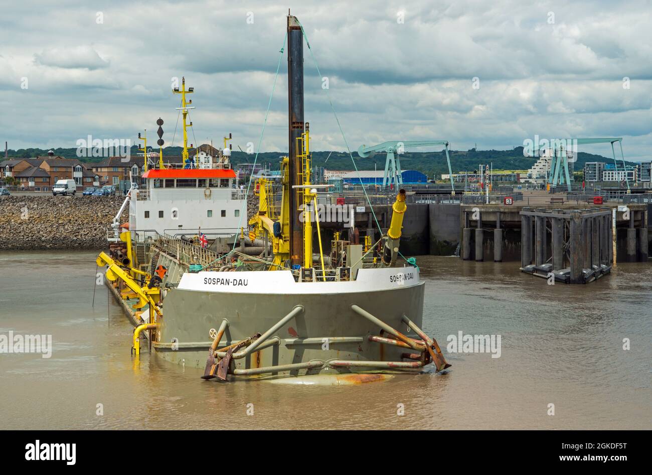 The Hopper Dredger Sospan-Dau dredging outside the lake of Cardiff Bay on a summer July day. Stock Photo