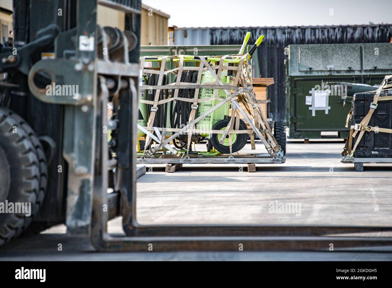 Palletized equipment sits on the 379th Expeditionary Logistics Readiness Squadron loading pad for the cargo deployment function at Al Udeid Air Base, Qatar, Feb. 24, 2021. The CDF was tested during the Agile Combat Employment capstone event throughout the U.S. Central Command area of responsibility and will have consistent real-world application for future operations. Stock Photo