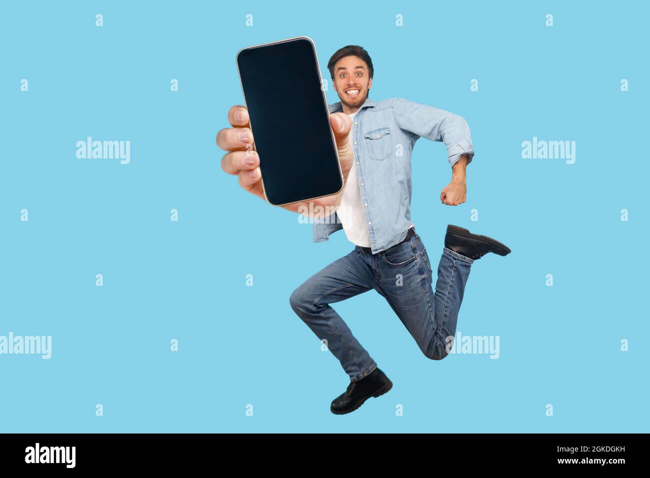 Man mobile phone jumping joy hi-res stock photography and images - Alamy