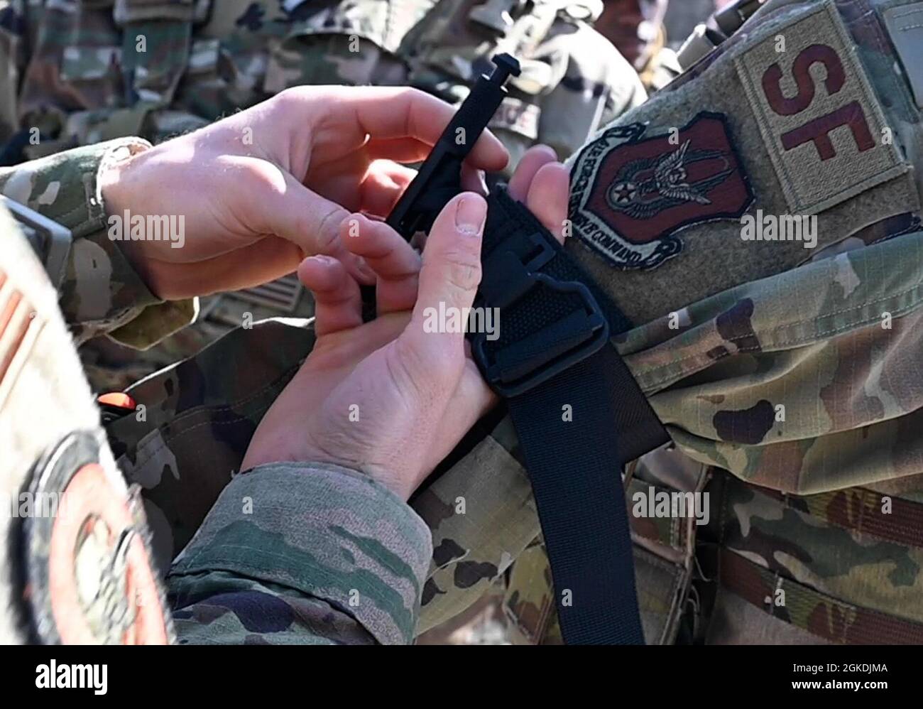 A member of the 910th Security Forces Squadron applies a tourniquet to ...