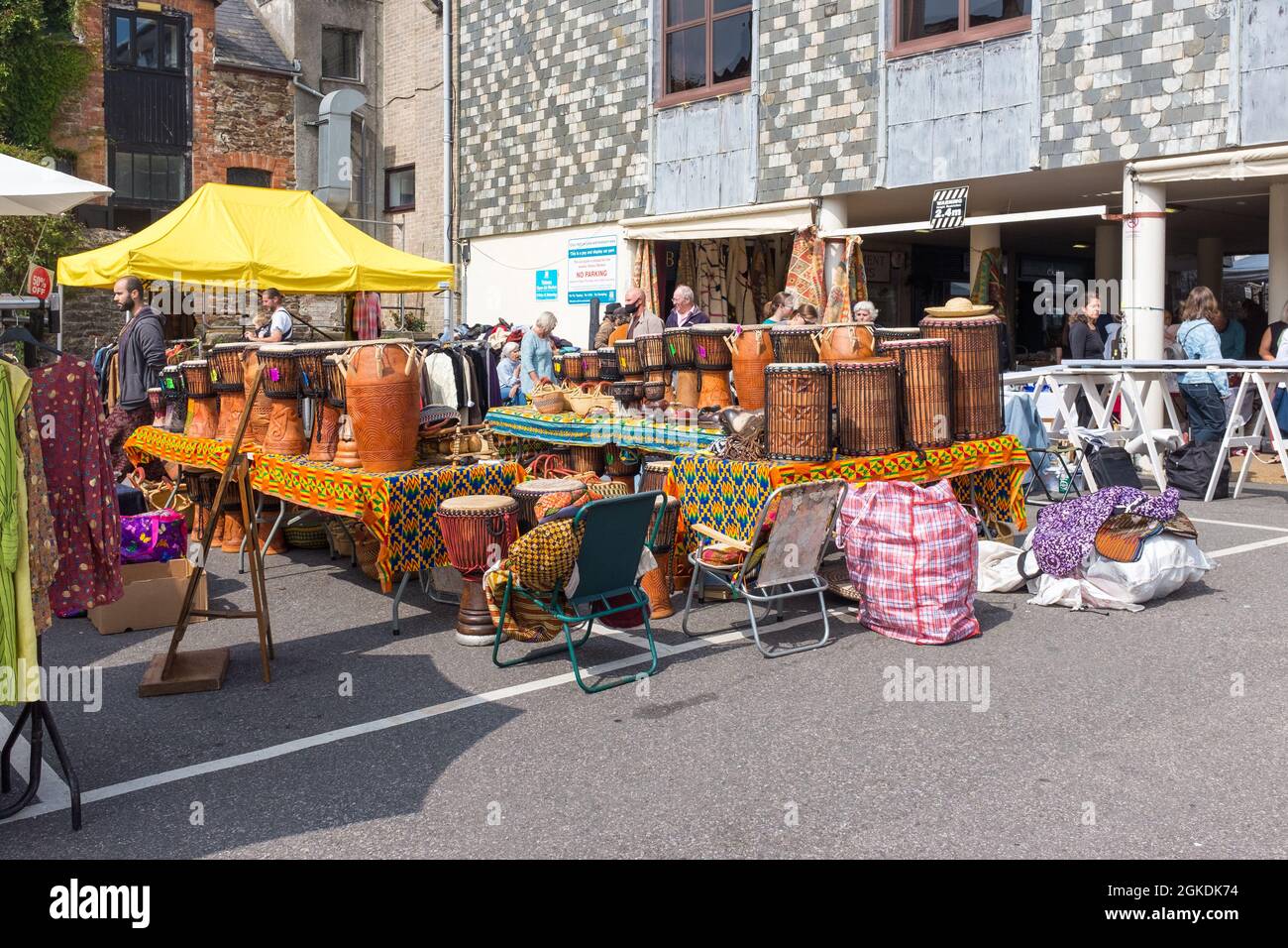 Stalls selling various objects from around the world at Totnes market, South Hams, Devon Stock Photo