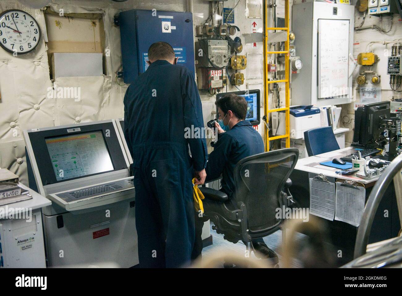210323-N-EI510-0033 GAETA, Italy (March 23, 2021) Military Sealift Command civil service mariners monitor a repair aboard the Blue Ridge-class command and control ship USS Mount Whitney (LCC 20) in Gaeta, Italy, March 23, 2021. Mount Whitney, forward deployed to Gaeta, Italy operates with a combined crew of Sailors and Military Sealift Command civil service mariners in the U.S. Sixth Fleet area of operations in support of U.S. national security interests in Europe and Africa. Stock Photo