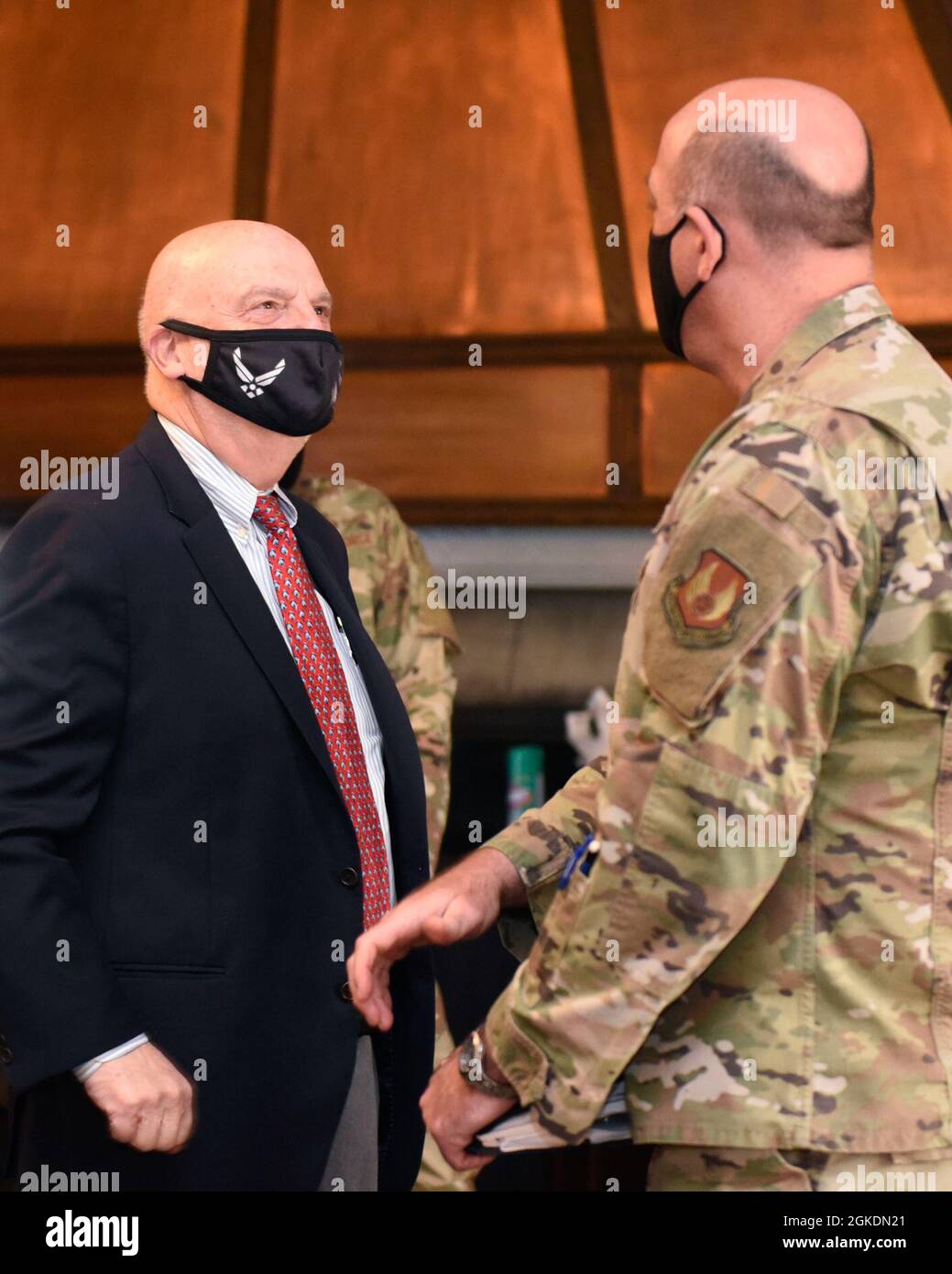 Acting Secretary of the Air Force John Roth talks with Col. Patrick ...
