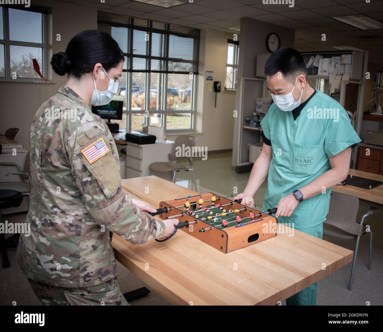 U.S. Army Capt. Bryan Yu, occupational therapist, plays a game with a