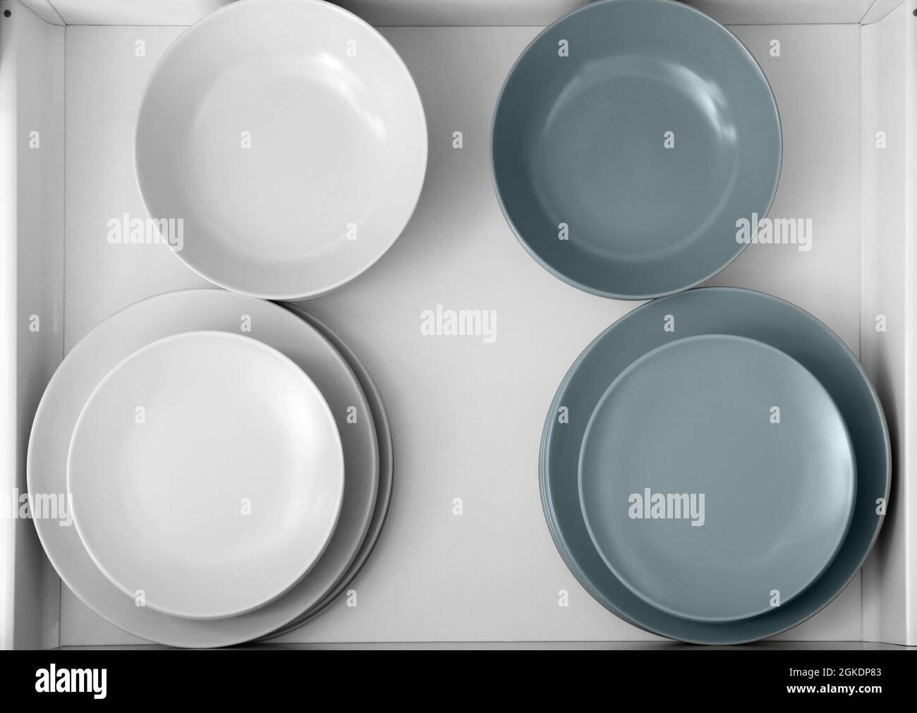 Plates in kitchen drawer Stock Photo Alamy