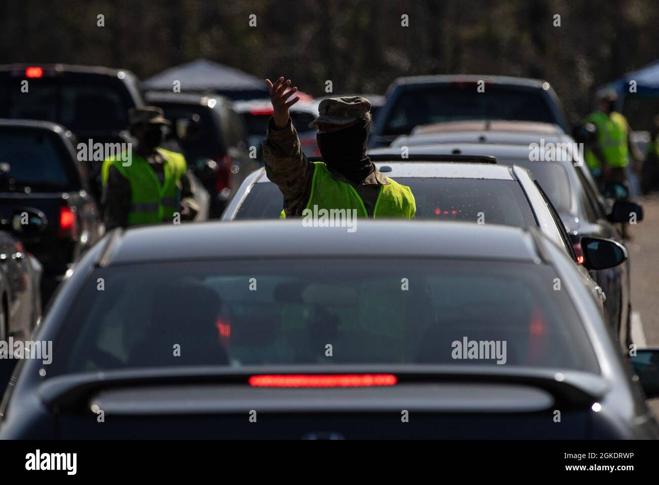Alabama National Guard Soldier directs traffic at a mobile vaccination