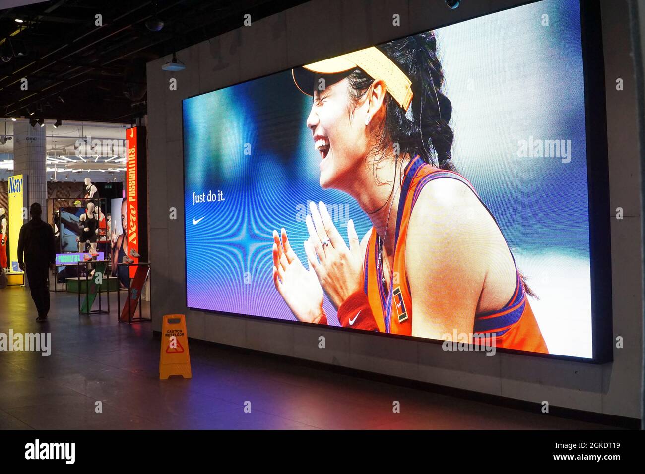 London, UK, 14 September 2021: At Nike Town at Oxford Circus in the heart of the West End giant screens show images of tennis prodigy Emma Raducanu, taken a moment after she won the US Open tennis tournament. Emma Raducanu is sponsored by Nike and expected to be able to build a lucrative career with sponsorships and commercial endorsements due to her extraordinary sporting ability combined with good looks, youth and multi-cultural appeal based on her joint Romanian and Chinese heritage. Anna Watson/Alamy Live News Stock Photo