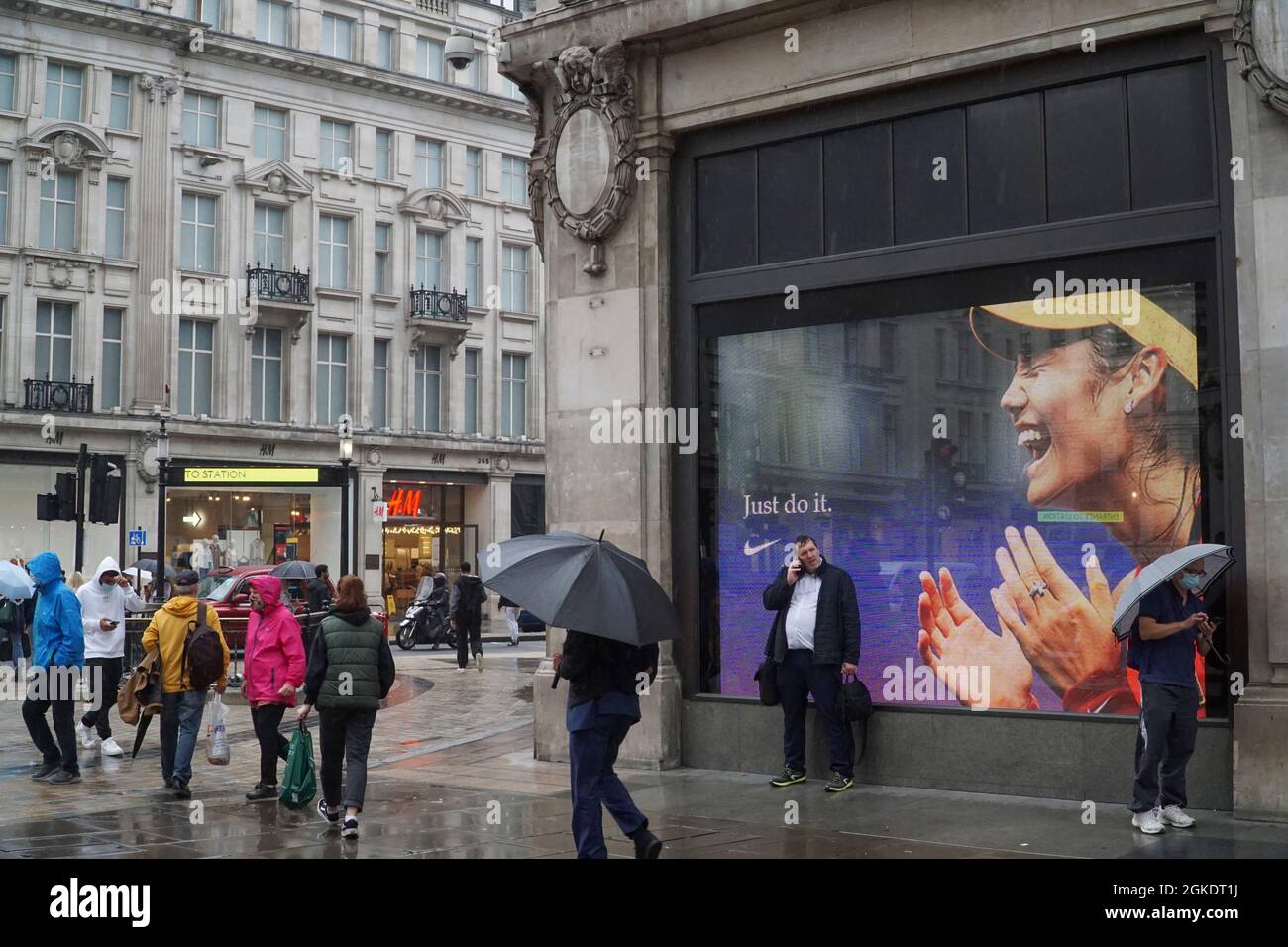 London, UK, 14 September 2021: At Nike Town at Oxford Circus in the heart of the West End giant screens show images of tennis prodigy Emma Raducanu, taken a moment after she won the US Open tennis tournament. Emma Raducanu is sponsored by Nike and expected to be able to build a lucrative career with sponsorships and commercial endorsements due to her extraordinary sporting ability combined with good looks, youth and multi-cultural appeal based on her joint Romanian and Chinese heritage. Anna Watson/Alamy Live News Stock Photo