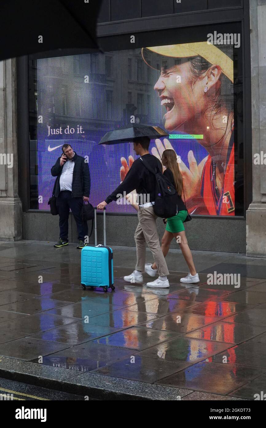 London, UK, 14 September 2021: At Nike Town at Oxford Circus in the heart  of the West End giant screens show images of tennis prodigy Emma Raducanu,  taken a moment after she