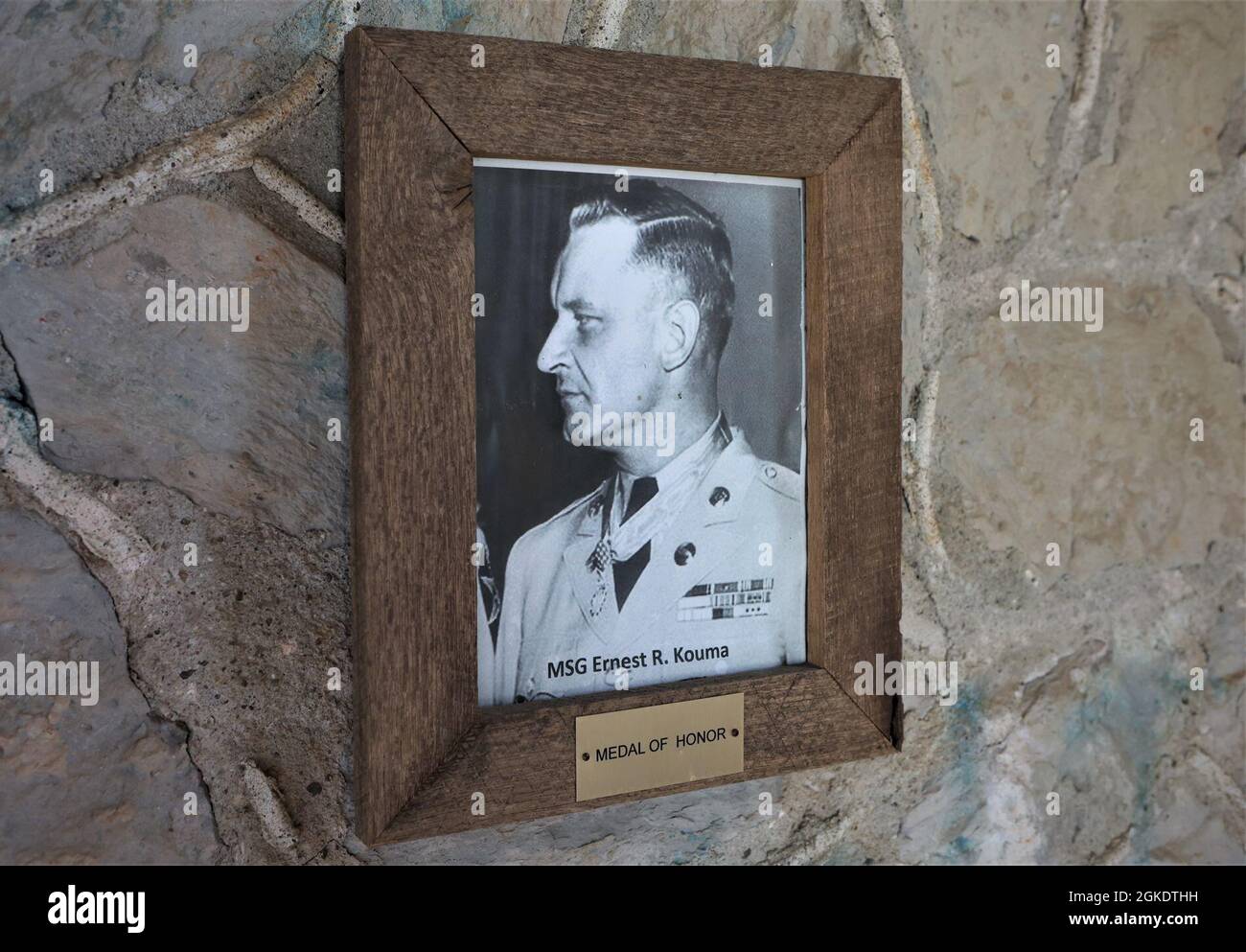 Hanging inside the small stone entrance to the Main Post Cemetery hangs a photo of its only Medal of Honor recipient. Stock Photo