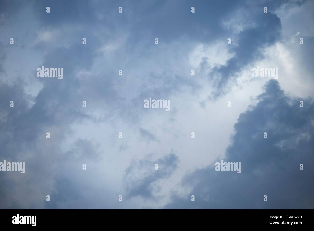 Mesmerizing clouds loaded with water to pour like rain inside. Vector, blue sky, cloud texture. Travel rain Stock Photo