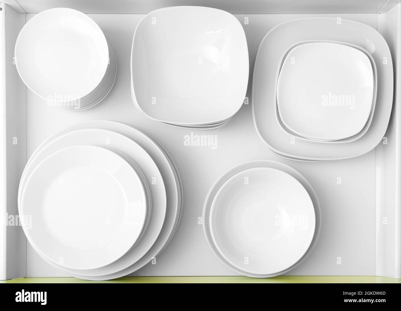 Plates in kitchen drawer Stock Photo Alamy