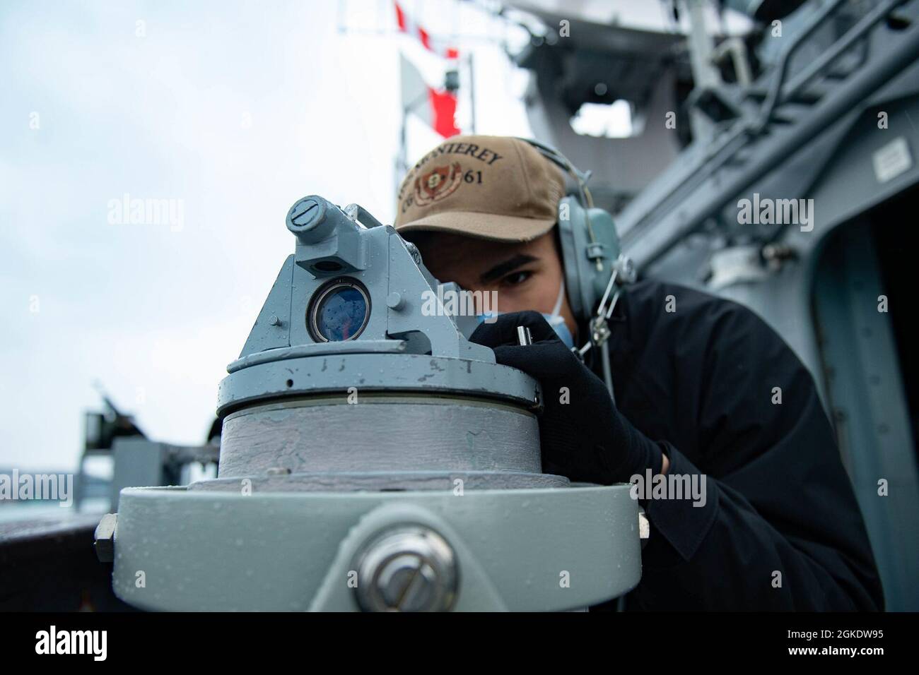 210324-N-WQ732-1020 MEDITERRANEAN SEA (March 24, 2021) Quartermaster 3rd Class Deion Palaez, from Miami, marks a bearing using a telescopic alidade as the Ticonderoga-class guided-missile cruiser USS Monterey (CG 61) transits the Mediterranean Sea, March 24, 2021.  Monterey is operating with the IKE Carrier Strike Group on a routine deployment in the U.S. Sixth Fleet area of operations in support of U.S. national interests and security in Europe and Africa. Stock Photo