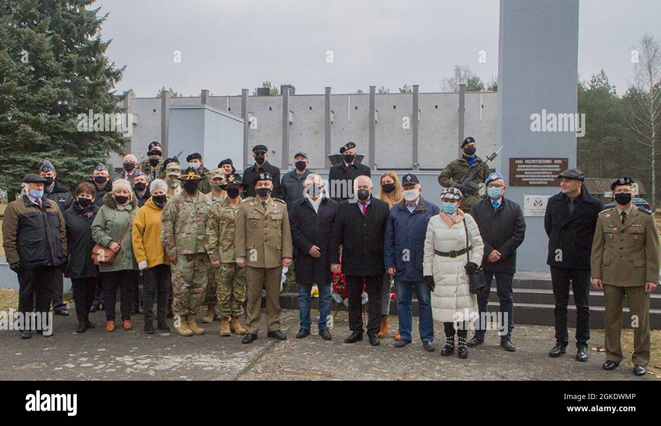 Representatives from the U.S. Army (left of center) from the Florida Guard’s 50th Regional Support Group and the 1st Armored Brigade, 1st Cavalry Division attend a remembrance ceremony in Zagan, Poland, on Mar. 24, 2021, with representatives from the Polish army and local officials. The ceremony commemorates the efforts of Allied service members who participated in the “Great Escape” from Stalag Luft III, a German prison-of-war camp, in March 1942. This event was later dramatized in the 1963 film “The Great Escape,” starring Steve McQueen and James Garner. Stock Photo