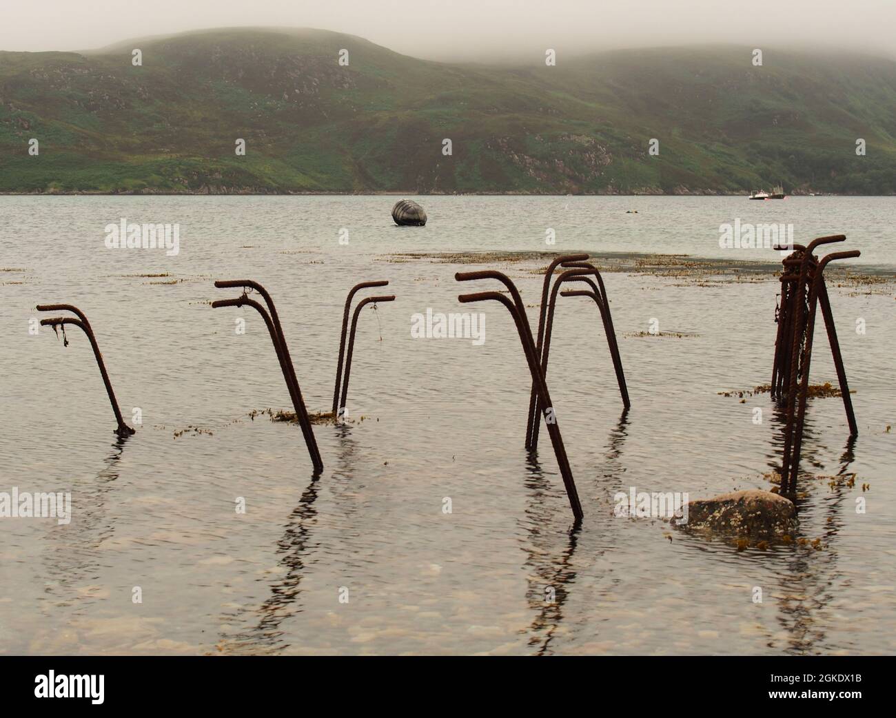 A view of disused oyster farming trestles upended in the Kyle of Durness Stock Photo
