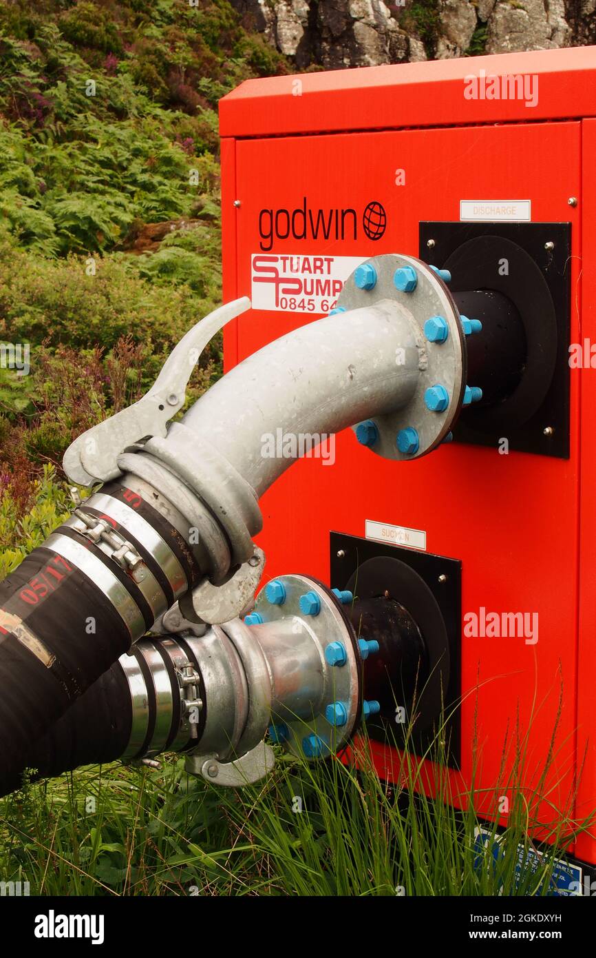 A Godwin ground water control pump for ground water control, showing the massive pipes joined to the machine Stock Photo