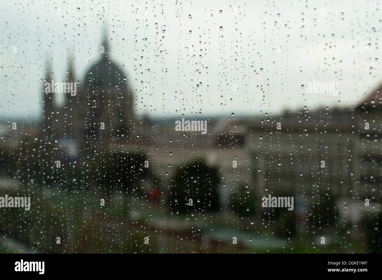 View of Viennese buildings through window on rainy day Stock Photo