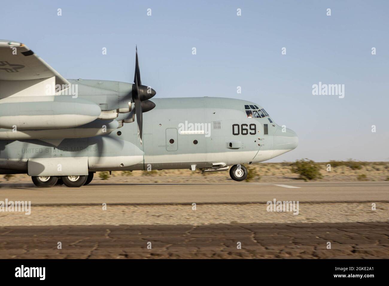 A U.S. Marine Corps KC-130J Hercules, with Marine Aviation Weapons and Tactics Squadron One (MAWTS-1), prepares to launch in support of Weapons and Tactics Instructor (WTI) course 2-21, at Auxiliary Airfield II, near Yuma, Ariz., March 24, 2021.  The WTI course is a seven-week training event hosted by MAWTS-1, providing standardized advanced tactical training and certification of unit instructor qualifications to support Marine aviation training and readiness, and assists in developing and employing aviation weapons and tactics. Stock Photo