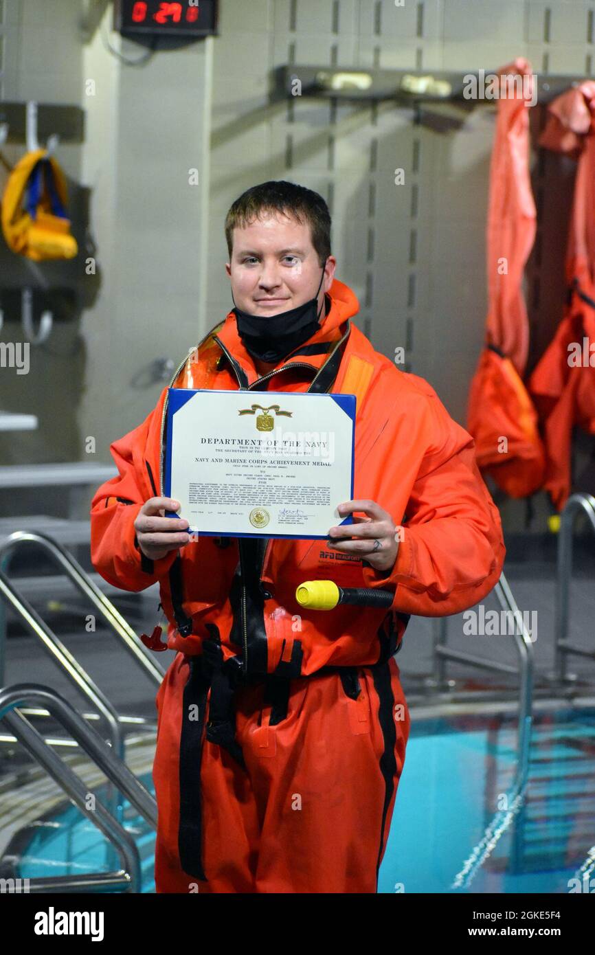 Navy Diver 2nd Class DSW Paul B. Swopes receives the Naval Submarine School s Sailor of the Quarter award for Q2 2021 at a ceremony aboard Naval Submarine Base New London CT on