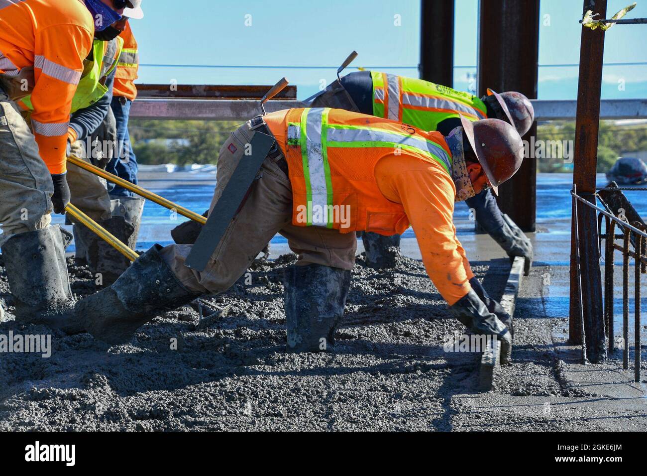 Contractors with the U.S. Army Corps of Engineers Sacramento District place  concrete on the roof of the Community Based Outpatient Clinic at the VA  Stockton medical complex in Stockton, California, on March