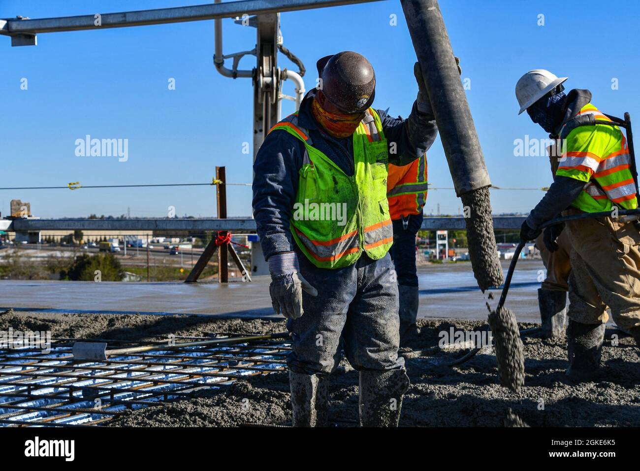 Contractors with the U.S. Army Corps of Engineers Sacramento District place concrete on the roof of the Community Based Outpatient Clinic at the VA Stockton medical complex in Stockton, California, on March 26, 2021. The day’s placement was the last large-scale concrete placement on the structure, which broke ground in November 2019. The CBOC is only one component of the planned complex, which also includes a Community Living Center and supporting structures housing utilities and logistics spaces. Stock Photo