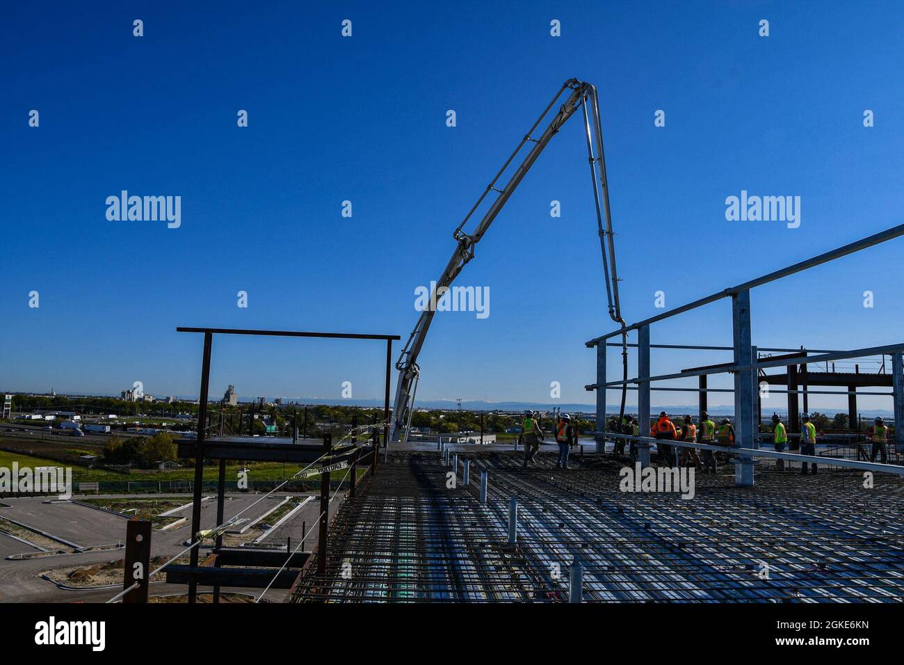 Contractors with the U.S. Army Corps of Engineers Sacramento District place concrete on the roof of the Community Based Outpatient Clinic at the VA Stockton medical complex in Stockton, California, on March 26, 2021. The day’s placement was the last large-scale concrete placement on the structure, which broke ground in November 2019. The CBOC is only one component of the planned complex, which also includes a Community Living Center and supporting structures housing utilities and logistics spaces. Stock Photo