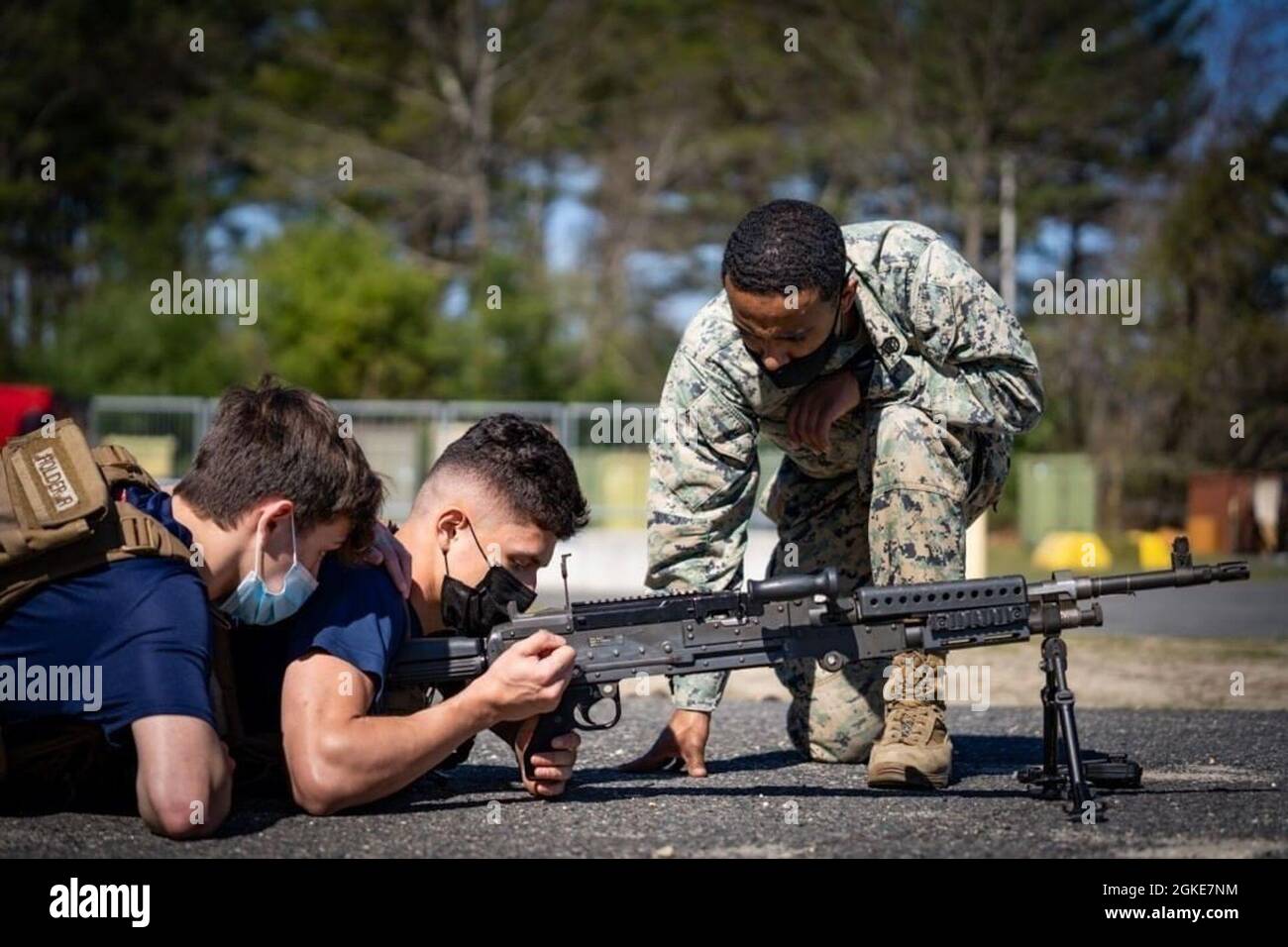 Marine Poolees with Recruiting Sub-Station Hackensack practice dry firing an M240B medium machine gun on Fort Dix, New Jersey, March, 26, 2021. Marine recruiters routinely practice drill, knowledge, and weapons functions with their poolees during monthly pool functions. Stock Photo