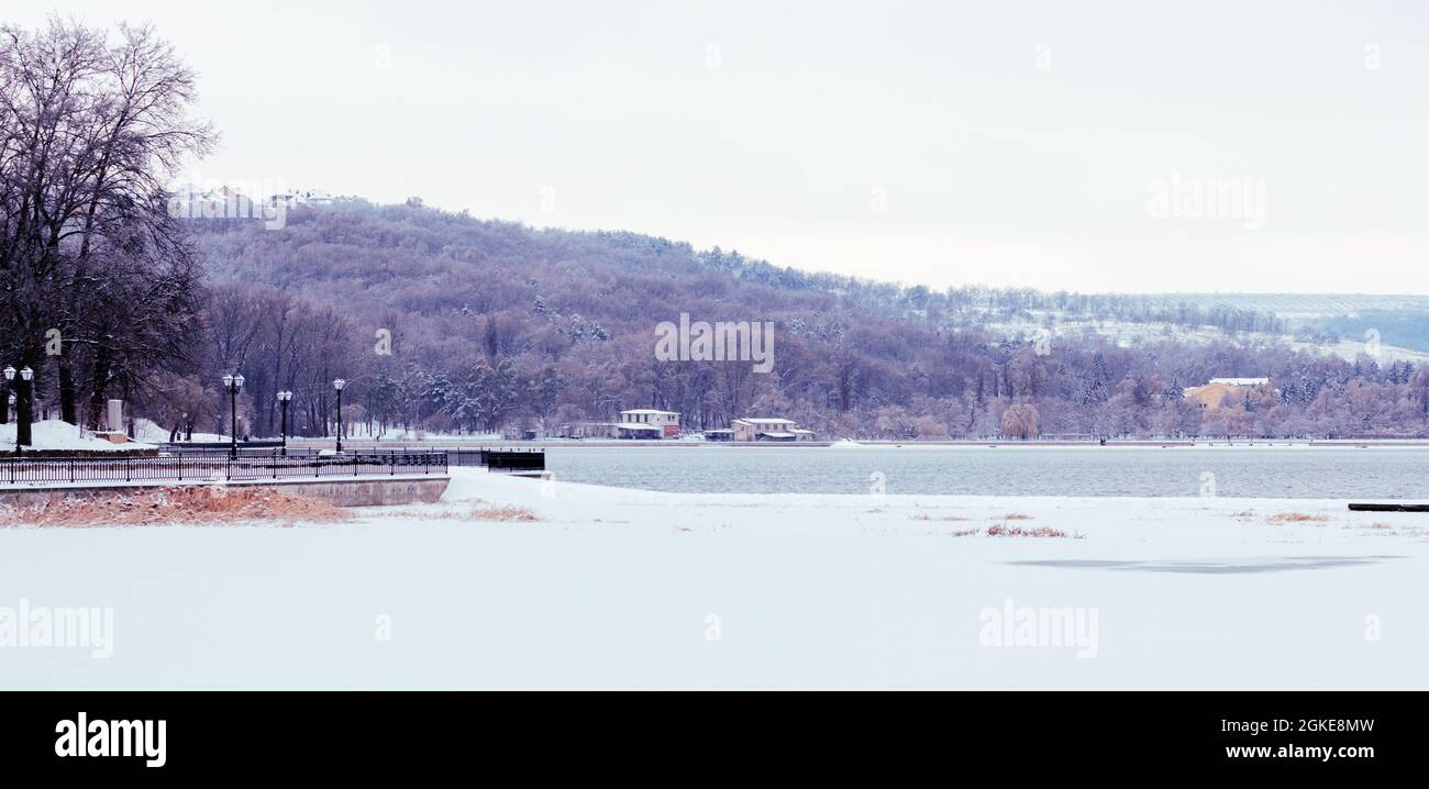 Landscape frozen lake and park on which people walk in winter Stock ...
