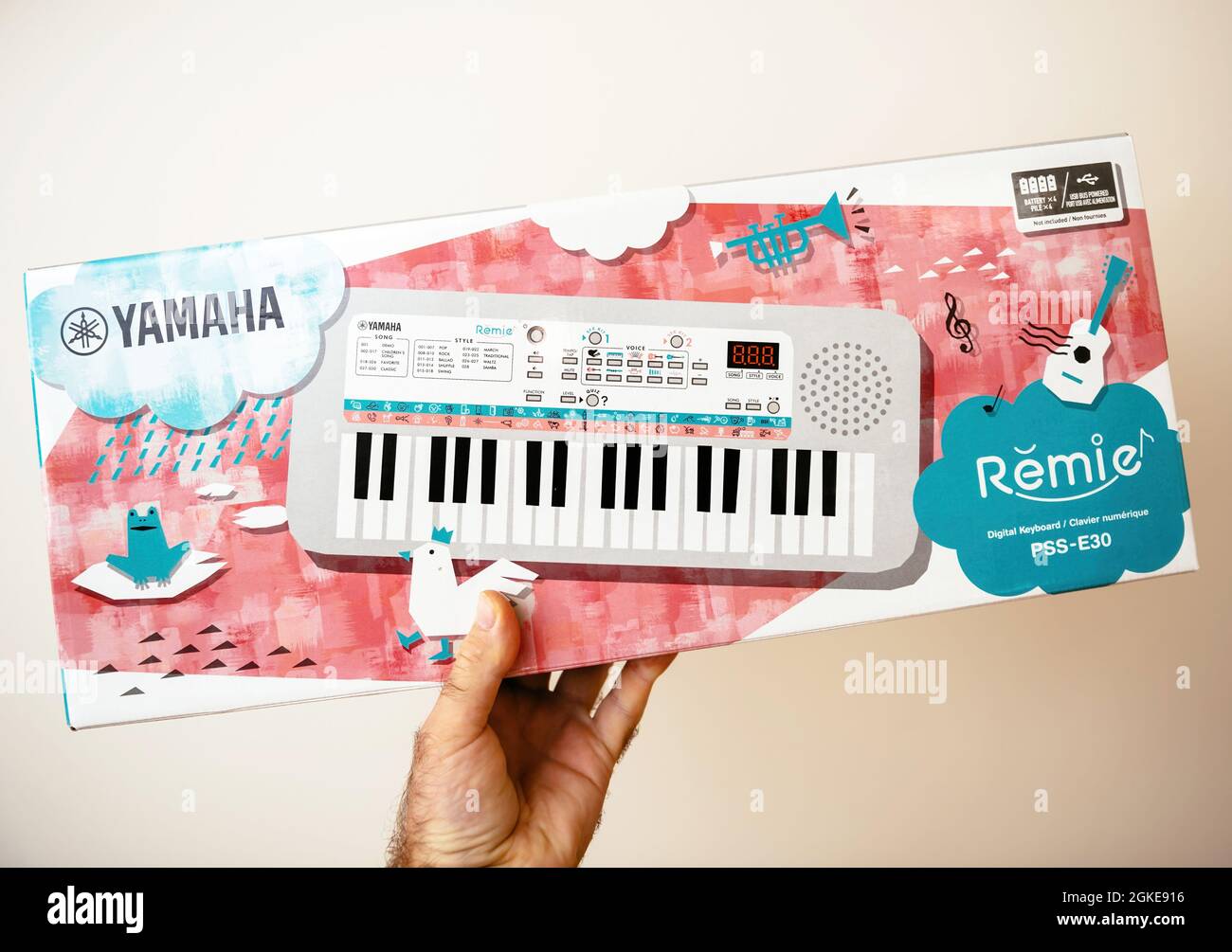 POV male hand holding new Yamaha Remie digital keyboard PSS-E30 for kids  Stock Photo - Alamy