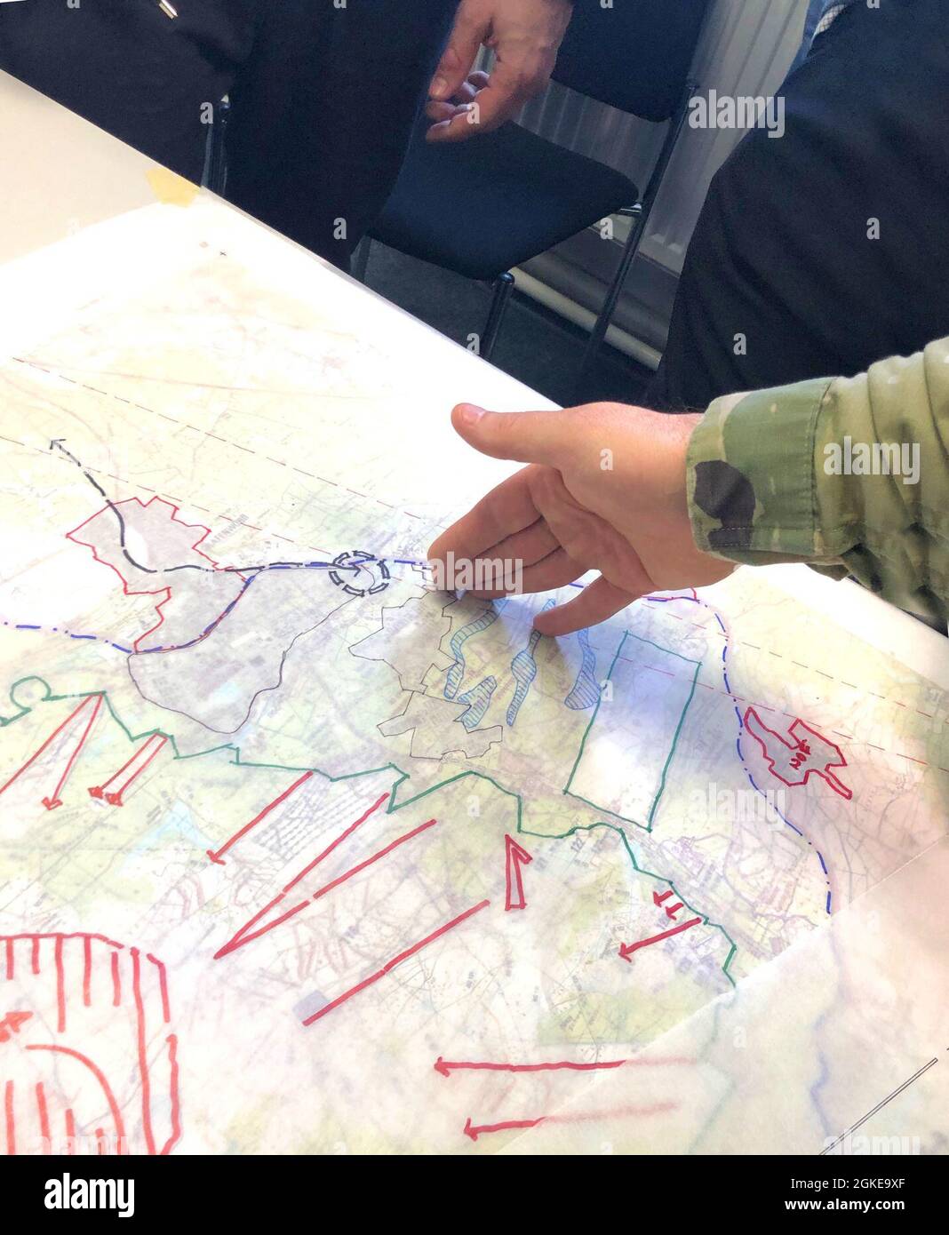 Soldiers and Civilian personnel discuss possible future plans for sections of the Grafenwoehr Training Area during collaboration sessions in spring 2019 that were part of creating an Area Development Execution Plan to outline the long-term plan for the area. Stock Photo