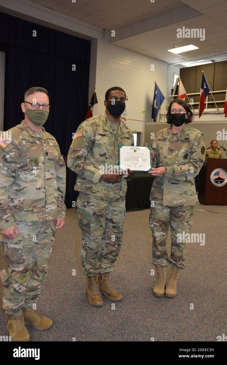 Cpl. Larry Lowe, Jr. (center), the Fort Irwin Dental Clinic 1 noncommissioned officer in charge, receives an Army commendation medal March 29 at Joint Base San Antonio, Texas for winning the Regional Dental Command-Central’s NCO of the Year competition. Lowe, a Stafford, Va. native, and other competitors participated in multiple events over several days including a ruck march, day and night land navigation, an obstacle course, the Army Combat Fitness Test and an Army knowledge board. Stock Photo