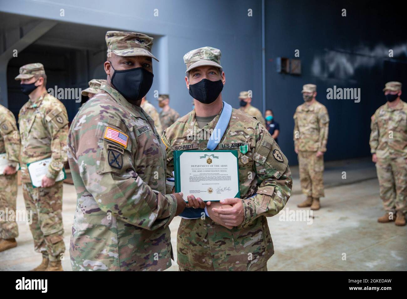 Leadership from the 25th Division Sustainment Brigade presents awards ...