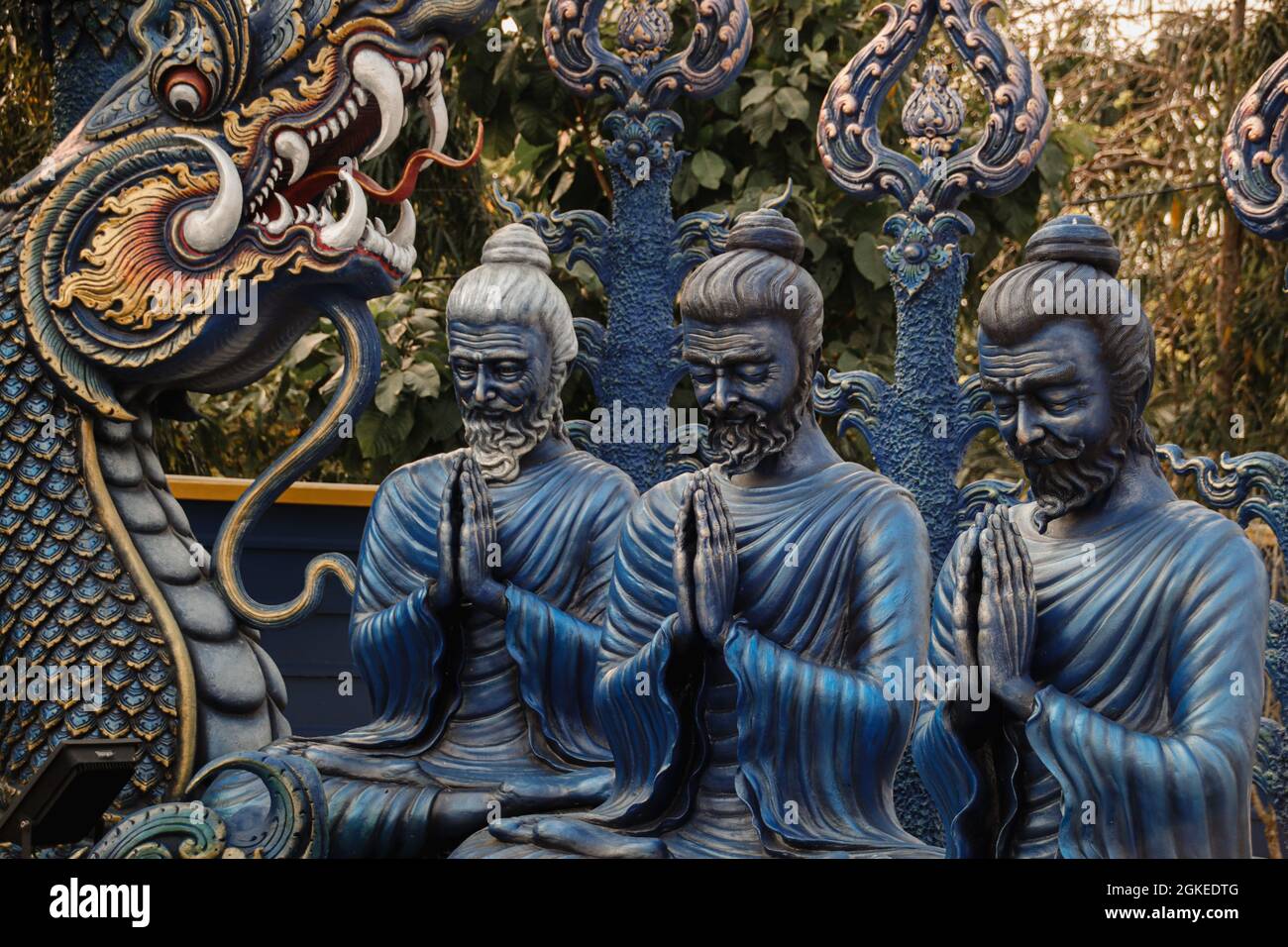Praying statues from the Blue Temple in Chiang Rai, Thailand. Wat Rong ...