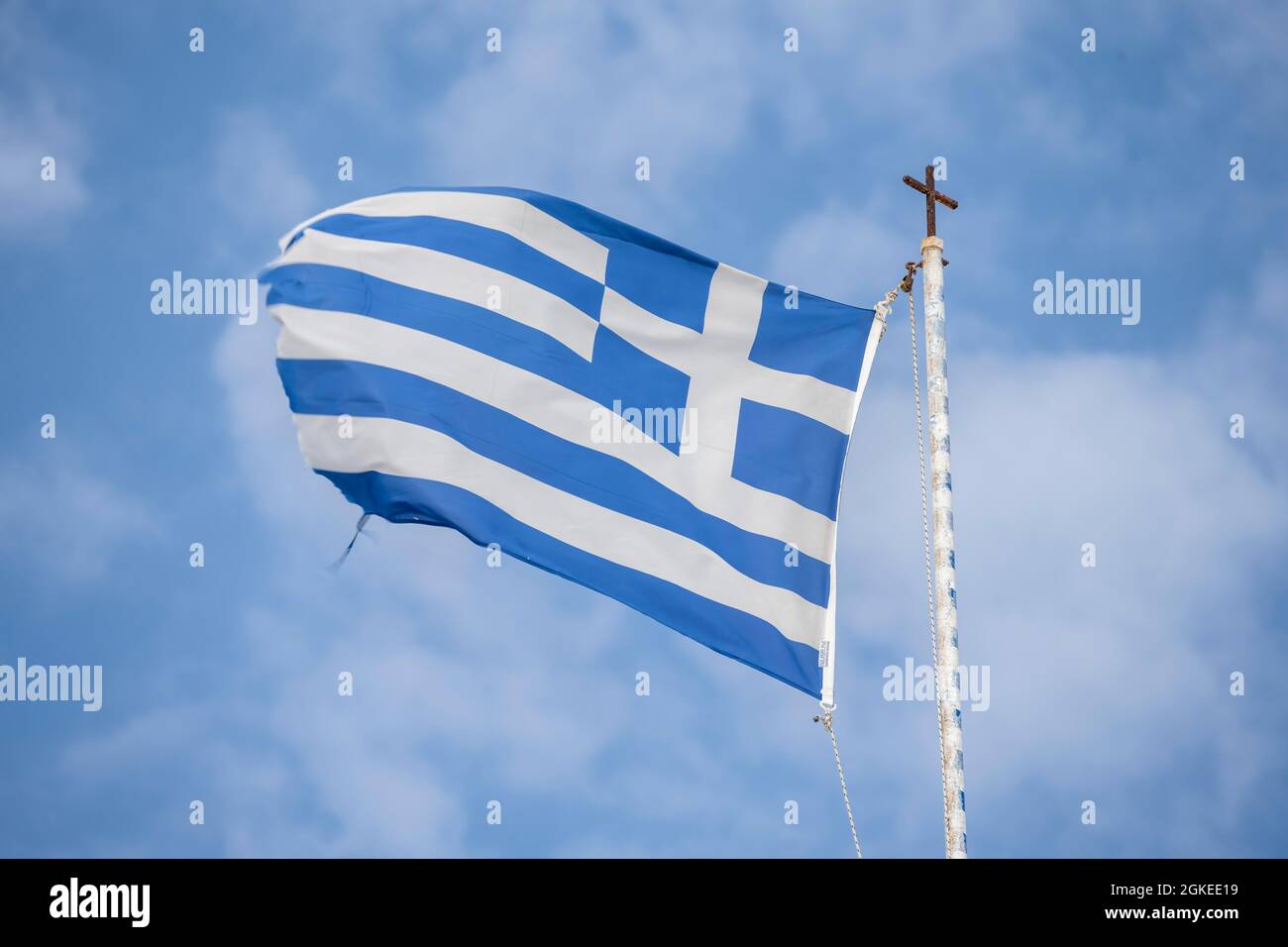 Greek flag on flagpole, Greece Stock Photo