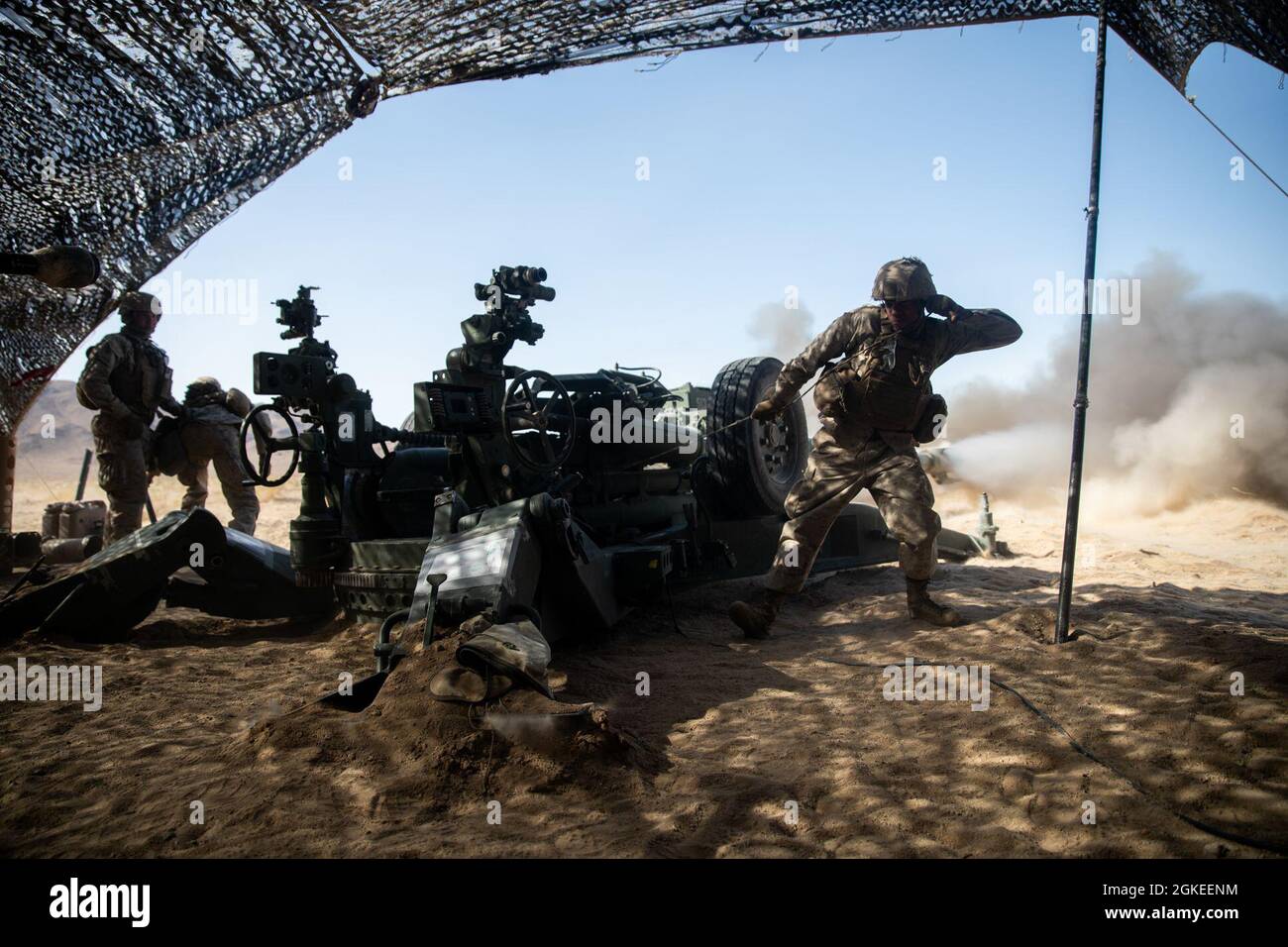 U.S. Marine Corps Cpl. Manuel Bautista, a field artillery cannoneer ...