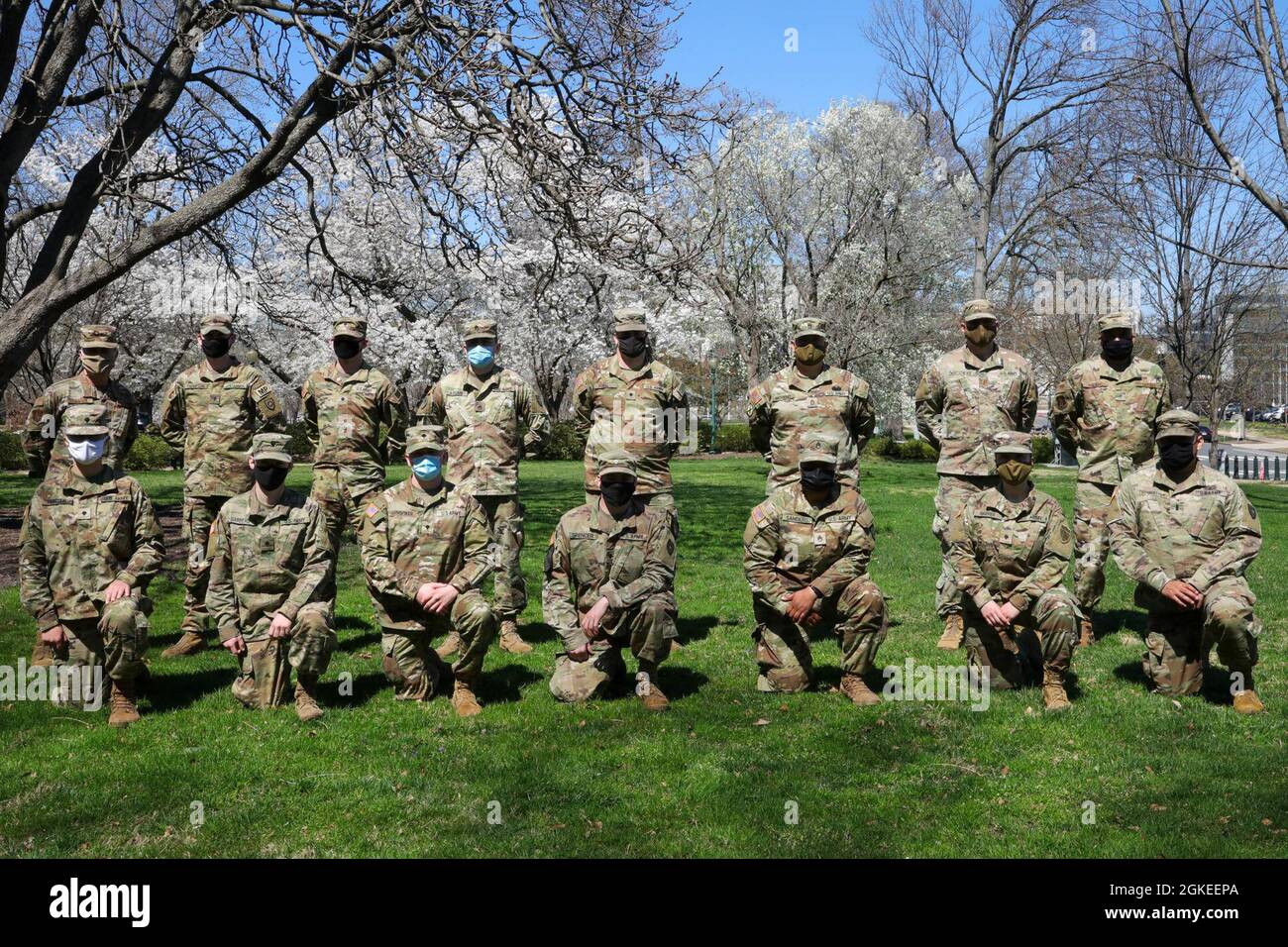U.S. Soldiers with the Kentucky National Guard pose for a photograph with U.S. Air Force Brig. Gen. Charles Walker, top row, far right, chief of staff, Kentucky Air National Guard, near the U.S. Capitol in Washington, D.C., March 30, 2021. The National Guard has been requested to continue supporting federal law enforcement agencies with security, communications, medical evacuation, logistics, and safety support to state, district and federal agencies through mid-March. Stock Photo