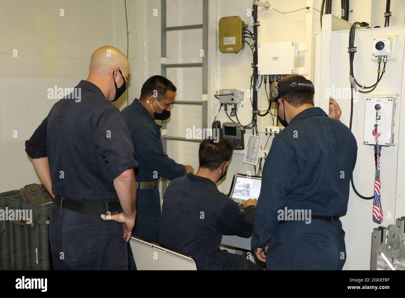 210330-N-N3764-0100  CARIBBEAN SEA - (March 30, 2021) -- Chief Gunner’s Mate Daniel Gibbs, second from left, instructs Sailors in the MK 110 57mm gun magazine aboard the Freedom-variant littoral combat ship USS Wichita (LCS 13) during a combat systems training team drill, March 30, 2021 Wichita is deployed to the U.S. 4th Fleet area of operations to support Joint Interagency Task Force South’s mission, which includes counter illicit drug trafficking in the Caribbean and Eastern Pacific. Stock Photo