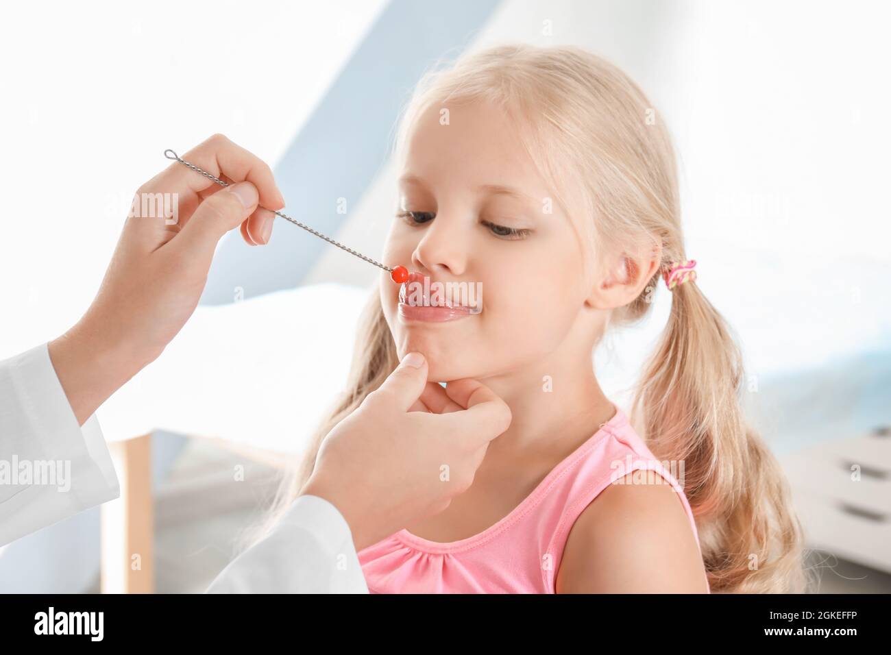 Cute girl at speech therapist's office Stock Photo