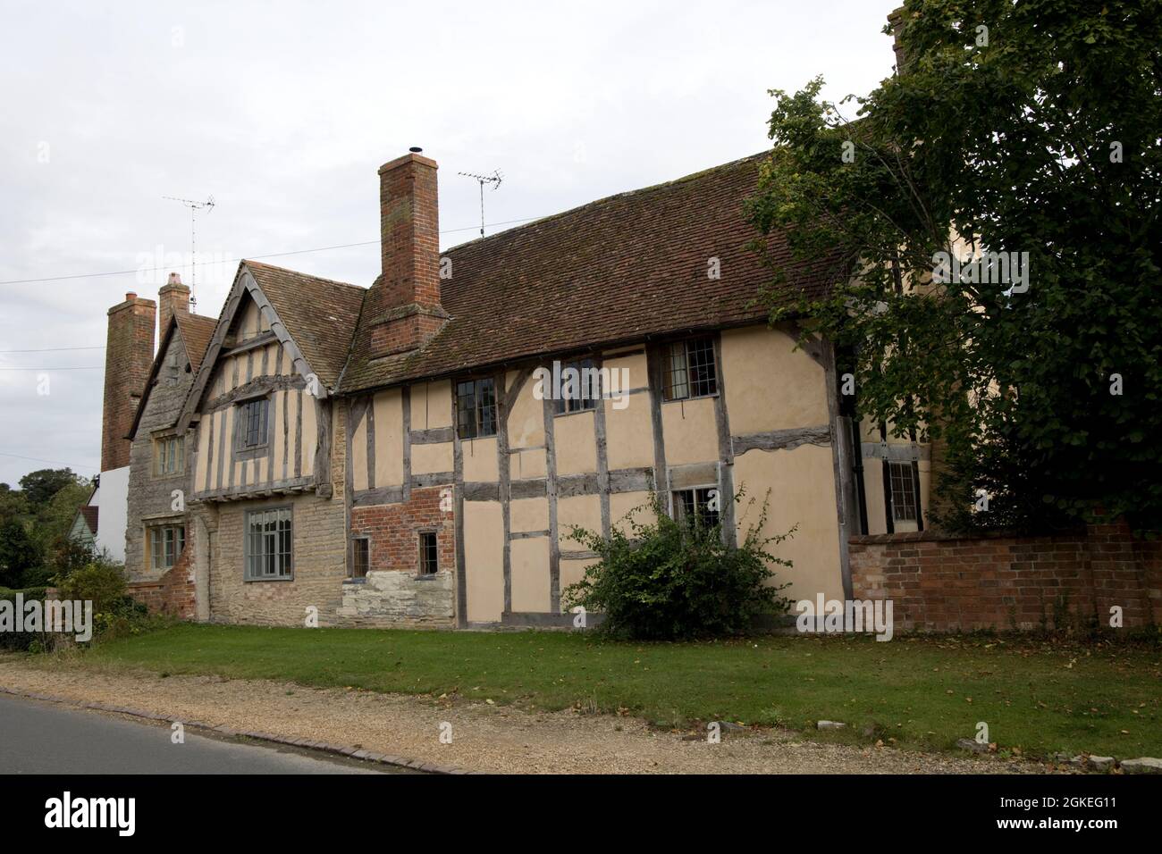 Wisson Hill is a late 16th Centry classic Grade two half-timbered house with tiled roof and two brick chimneys Barton near Bidford on Avon Warwickshir Stock Photo