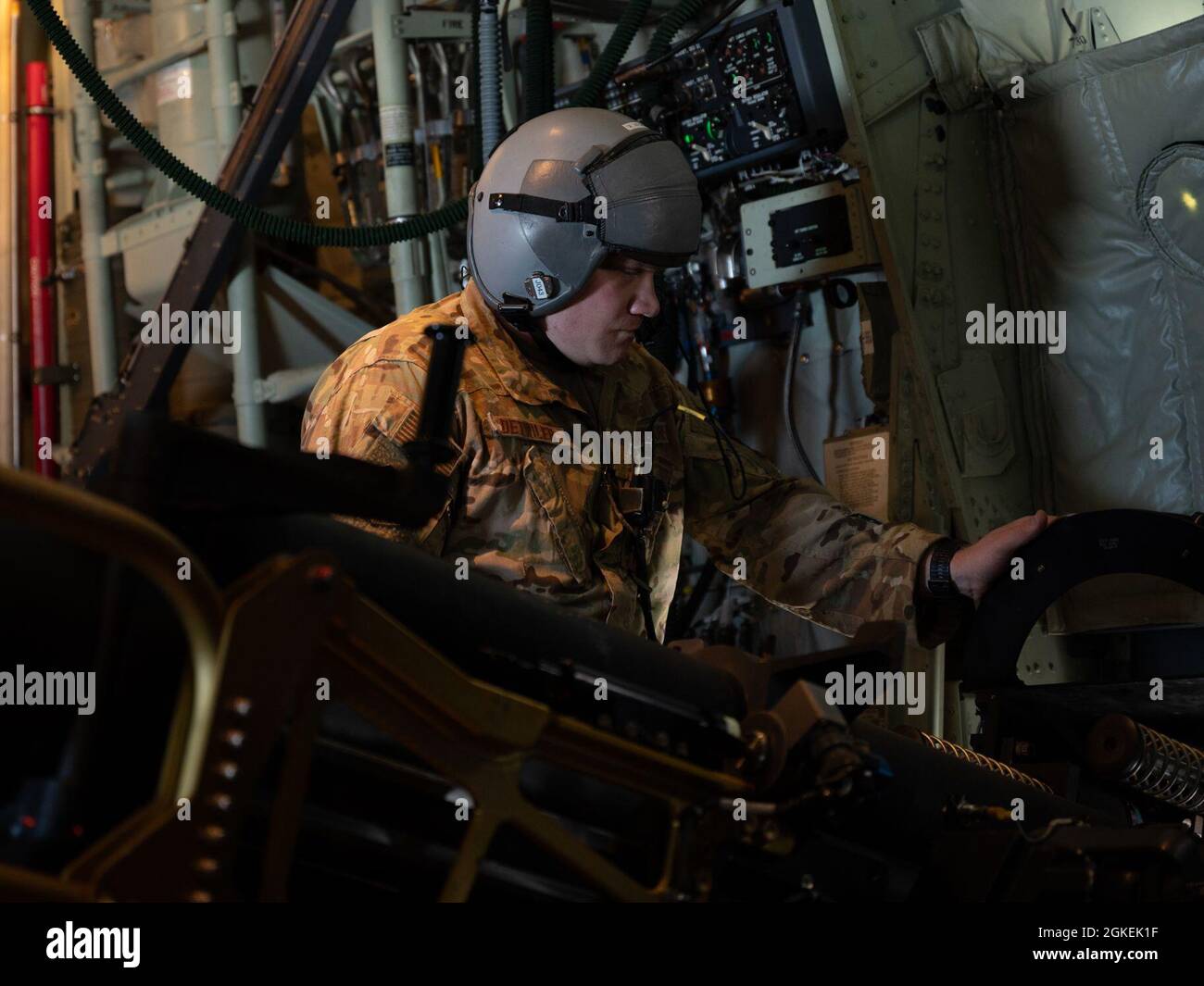 U.S. Air Force Tech. Sgt. Kyle Detwiler, a special missions aviator assigned to the 492nd Special Operations Wing, operates a 105mm cannon on an AC-130J Ghostrider gunship during a live-fire training mission over the Eglin Range, Florida, Mar. 31, 2021. The 492nd SOW conducts qualification flight training and specialized combat training. They are responsible for assessing, educating and professionally developing Airmen and rapidly developing innovative courses and technologies to meet emerging Air Force Special Operations Command requirements. Stock Photo