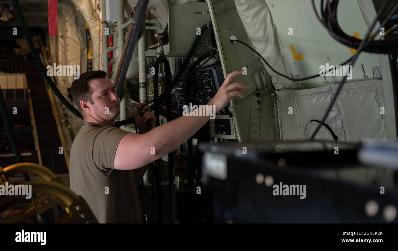 U.S. Air Force Staff Sgt. Tyler Nelson, a special missions aviator assigned to the 492nd Special Operations Training Support Squadron, conducts pre-flight inspections during an AC-130J Ghostrider Gunship training mission at Hurlburt Field, Florida, Mar. 31, 2021. The 492nd SOTRSS conducts qualification flight training and specialized combat training. They are responsible for assessing, educating and professionally developing Airmen and rapidly developing innovative courses and technologies to meet emerging Air Force Special Operations Command requirements. Stock Photo