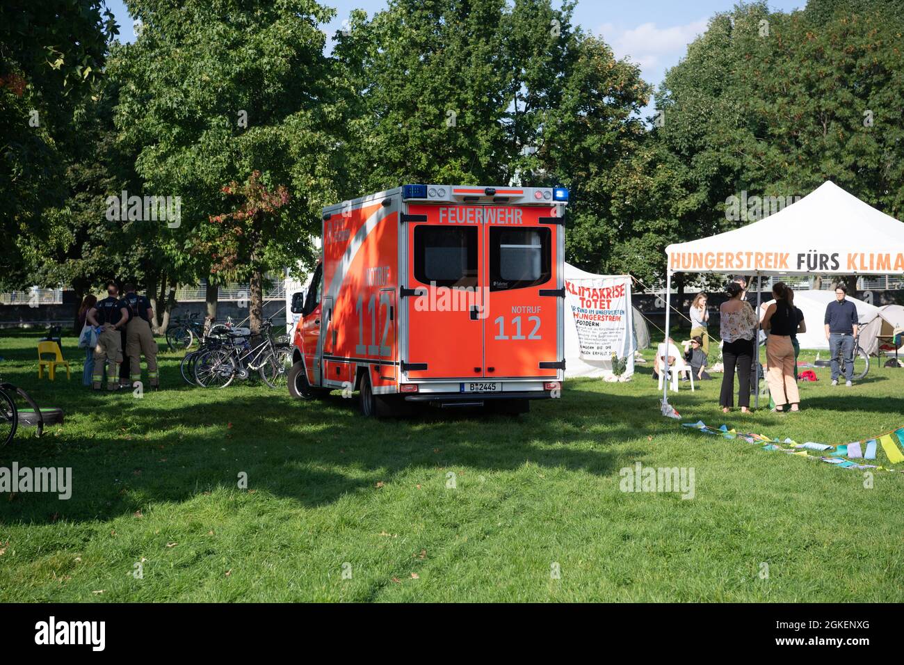 Berlin, Germany. 14th Sep, 2021. An ambulance stands in the camp of the climate activists in the government district. Activists have been on hunger strike there for days. In the afternoon, one of the climate activists had to be taken to hospital by ambulance. Credit: Paul Zinken/dpa/Alamy Live News Stock Photo