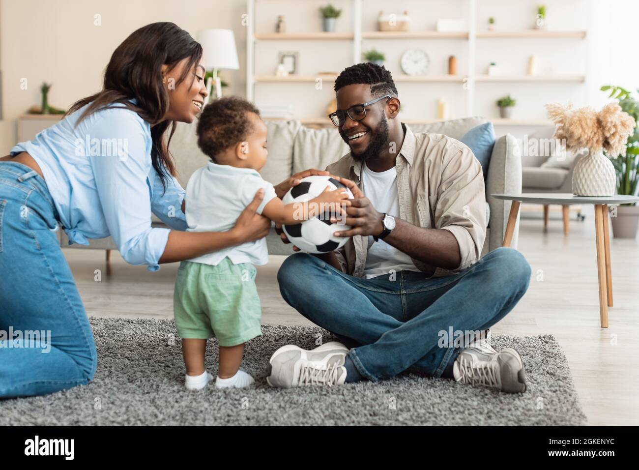 Portrait of happy black family smiling playing at home Stock Photo - Alamy