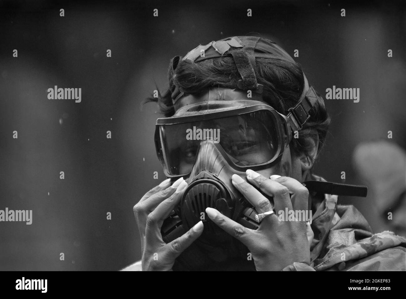 Staff Sgt. Tiffanie Pulley, 217th Military Police Detachment, makes adjustments to her protective mask during chemical, biological, radiological and nuclear training April 1 at the range training complex. She was one of 35 unit members to undergo the annual training requirement. Stock Photo