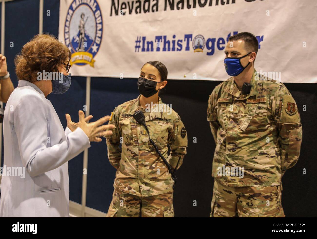 U.S. Senator Jacky Rosen talks with 2nd Lt. Samirah Furman and 1st Sgt. Brandon Herbert with Joint Task Force 17 at the Cashman vaccine center, Thursday, Apr. 1, 2021 in Las Vegas, Nevada. Stock Photo