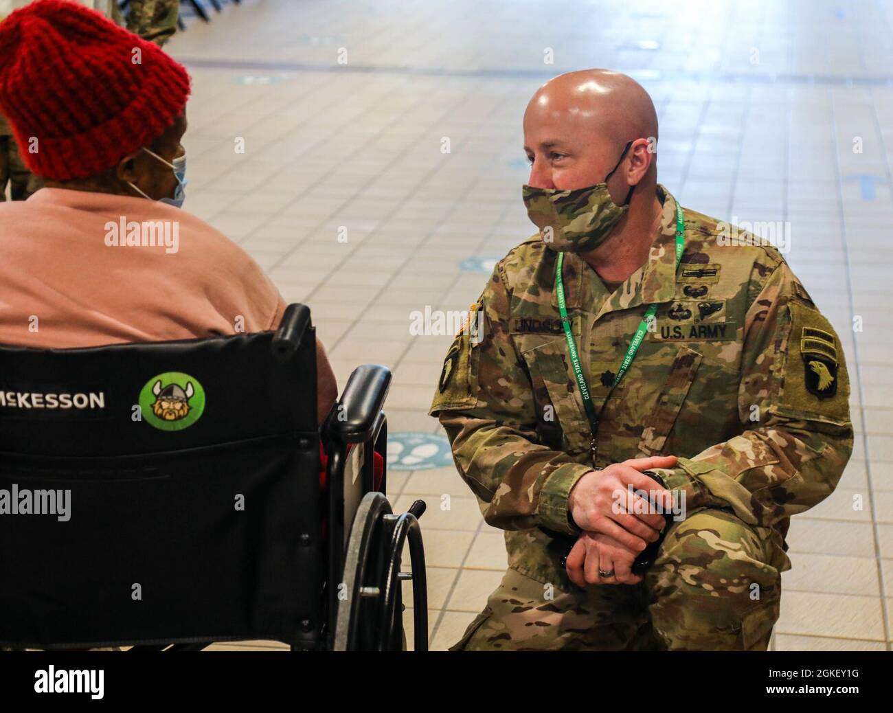 U.S. Army Lt. Col. Jon Lindsley, commander of Task Force Performance, 2nd  Brigade Combat Team, 101st Airborne Division (Air Assault), thanks Mrs.  Ruby Davis for coming to the Wolstein Community Vaccination Center (