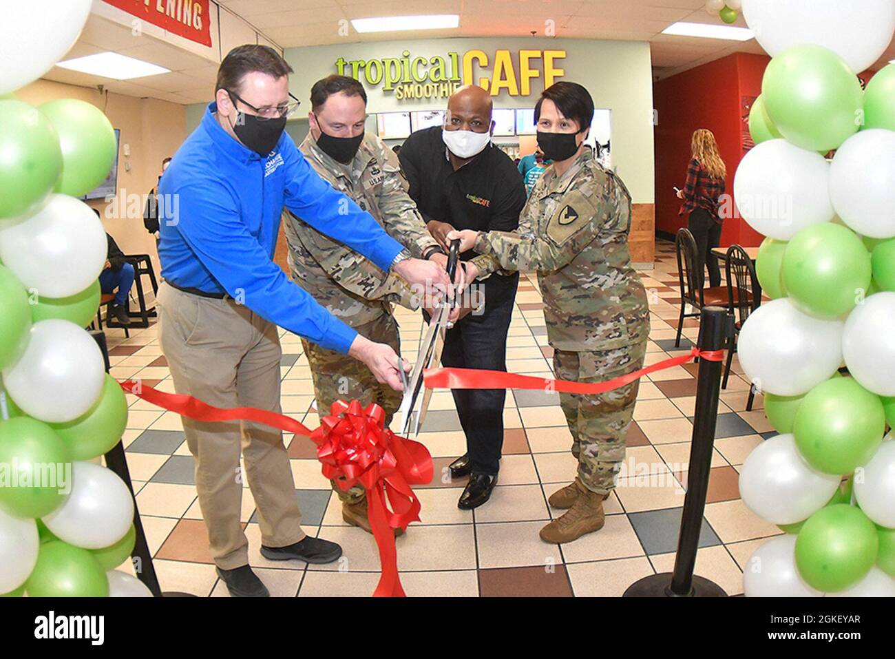 Eric Desveaux, Fort Lee Exchange general manager; Command Sgt. Maj. James  D. House, garrison CSM; Howard Raphael, franchise owner; and Col. Karin L.  Watson, garrison commander, cut the ribbon to officially open