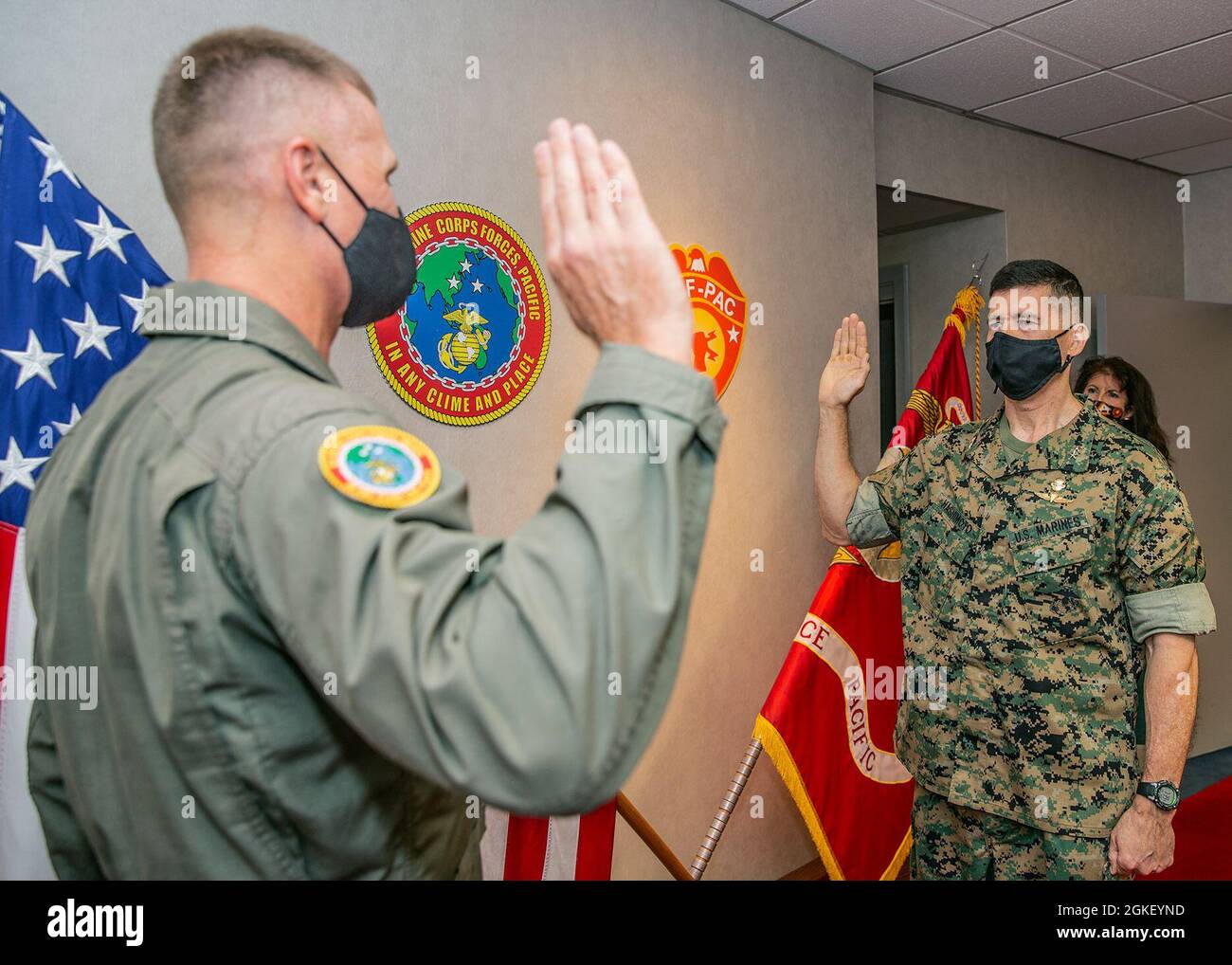 U.S. Marine Corps Lt. Gen. Rudder, left, commander, U.S. Marine Corps Forces, Pacific (MARFORPAC), administers the oath of office to Maj. Gen. Mark A. Hashimoto, commanding general, Force Headquarters Group, Marine Corps Forces Reserves, during his promotion ceremony on April 2, 2021 at Camp H.M. Smith, Hawaii. Hashimoto has served 29 years in the Marine Corps between active duty and the reserves. As a civilian he serves as the executive director, MARFORPAC. Stock Photo